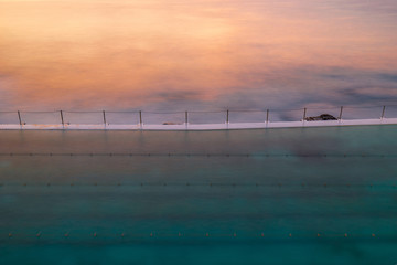 Empty swimming pool by the ocean.