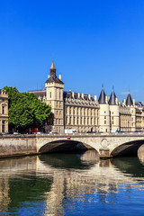 Naklejka na ściany i meble Conciergerie Castle and Bridge of Change over river Seine. Paris, France