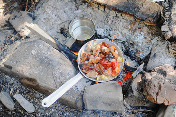 Preparing cooking breakfast in camping at forest.
