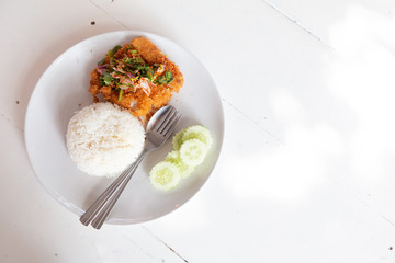 Fried fish spicy salad served with rice