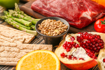 Different healthy food on wooden table