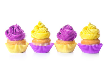 Sweet tasty cupcakes on white background