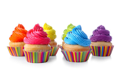 Sweet tasty cupcakes on white background