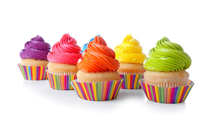 Sweet tasty cupcakes on white background