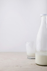 Homemade organic fresh kefir(yogurt,ayran,lassi,milky product) for breakfast in glass bottles on white background with copy space for text.Probiotic Indian cold fermented dairy drink.Trendy superfood