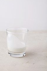 Homemade organic fresh kefir(yogurt,ayran,lassi,milky product) for morning in glass on white background close-up with copy space for text.Probiotic Indian cold fermented dairy drink.Trendy superfood