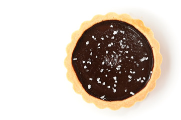 Salted chocolate tart on white background - isolated
