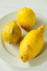 Trendy ugly organic lemon unusual shape on white background.Buying imperfect products is a way to deal with food waste
