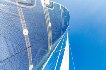 Sail of a Catamaran sailing boat against clear blue sky