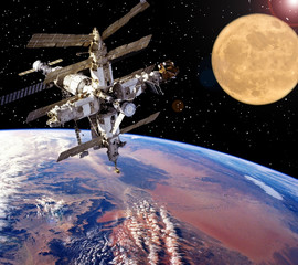 Spaceship and moon. Earth on the backdrop. The elements of this image furnished by NASA.