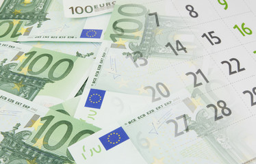 Planning and investing concept, euro banknotes and calendar