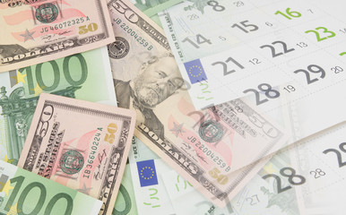 US dollars and euro banknotes and calendar page collage, investing concept