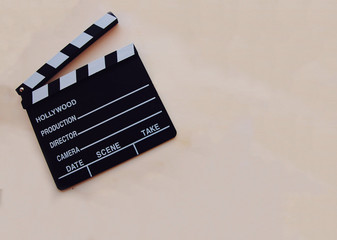 Naklejka premium White background with a movie clapboard.