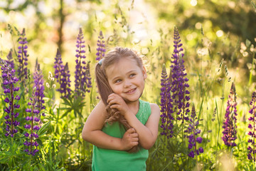 girl and  lupine flower in nature