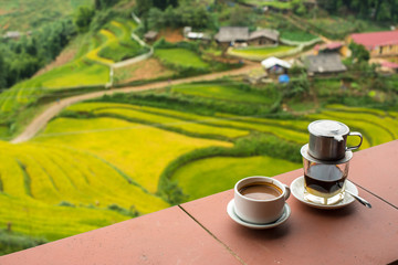 Drip Black Coffee vietnamese style on balcony with alpine background - can be used for display or montage your text (soft focus at cup)