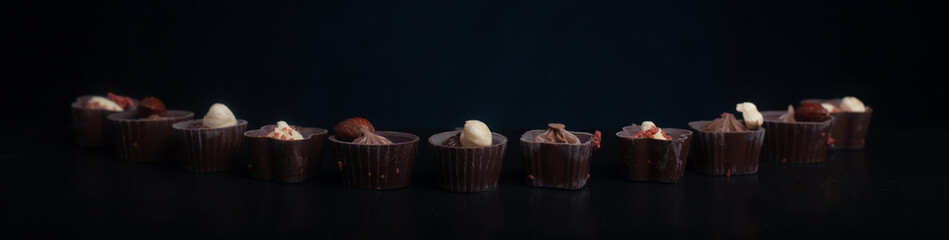 Chocolate candies on a dark background