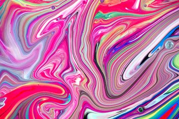 Abstract multi-colored paint background. Acrylic texture with marble pattern. Wallpaper. Mixing paints. Modern art.