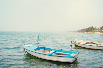 Naklejka na ściany i meble Beautiful landscape with seashore and fishing boat.