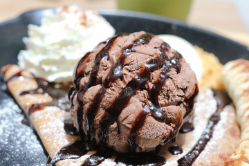 ice cream on the waffle and wipping cream