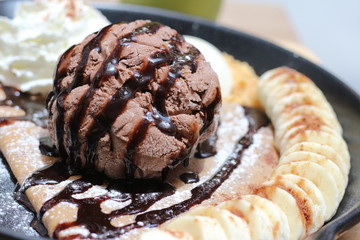 ice cream on the waffle and wipping cream