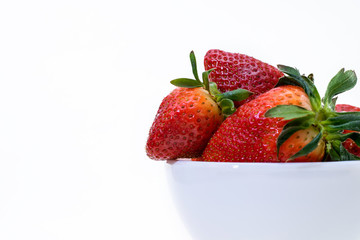 strawberry in white Cup on white background closeup
