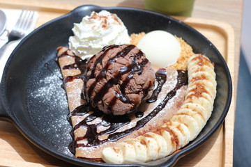 ice cream on the waffle and wipping cream