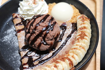 ice cream on the waffle and wipping cream