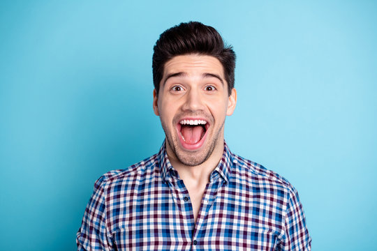 Close up photo of astonished lovely charming person sweet shout yell impressed incredible novelty satisfied enjoy wear checkered fashionable outfit isolated blue background