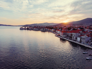 Obraz premium Beautiful sunset landscape. Aerial shot of the Kastel coast in Dalmatia,Croatia.Old town near Adriatic sea.