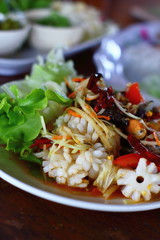 A delicious spicy papaya salad with seafood in thaifood