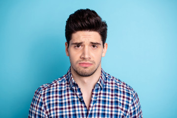 Close up photo amazing but very sad he him his macho awful awkward wrong situation not fault pretty hairstyle hairdress wear casual checkered plaid shirt isolated bright blue background
