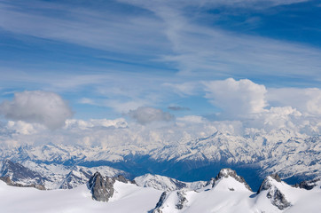 Fototapeta na wymiar Air view. Beautiful dramatic cloudy sky , mountains and snow peaks. Mont Blanc. Chamonix. France