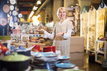 woman buying ceramic ware
