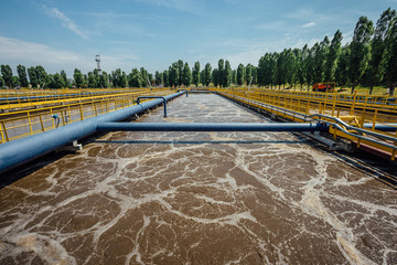 Modern wastewater treatment plant. Tanks for aeration and biological purification of sewage - obrazy, fototapety, plakaty