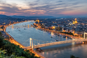 Fototapeta premium Aerial view of Budapest at sunset with lights on