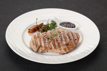 Grilled pork steak with pepper sauce