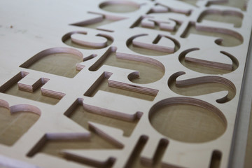 Cutted letters from a plywood. 