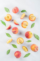 Fresh organic peaches, simple pattern, layout on white background