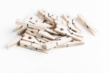 Wooden clothespins isolated on white background