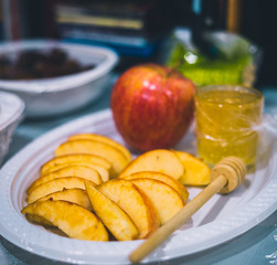 Plate with apple and honey for celebration