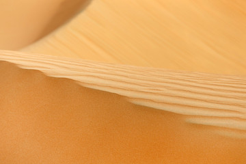 Sand pattern with shallow depth of field in the desert, UAE