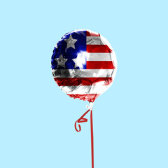 Celebrating an Independence day. Stars and Stripes, flag of United States of America on a balloon....