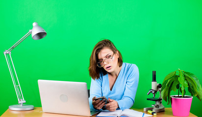 data and information. Business woman. chemist biologist with microscope on table. digital science....