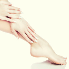 Naklejka premium care for sensuality woman hands and legs. Body care, healthy skin, manicure pedicure. Copy space