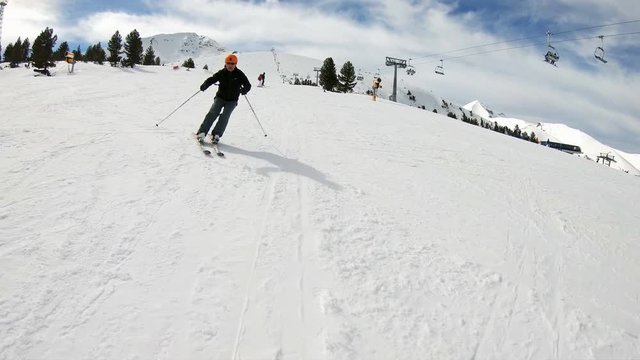 Young man skiing down a snow covered mountain, model Released, slow motion