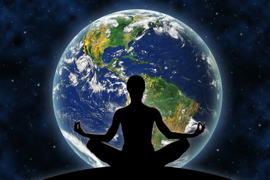 Female yoga figure against a space background and a planet Earth. Elements of this image furnished by NASA.