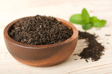 black tea on wooden background