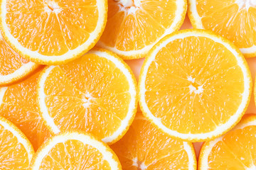 Fresh bright round orange slices. Shades of orange. Flat lay, top view, bright design. Fruit composition. Concept of vitamin C, healthy wholesome food.