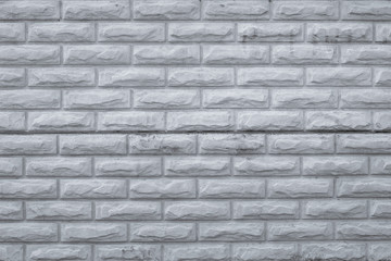 Gray dirty brick wall. Retro pattern with grey bricks wall, grunge background. Rough, vintage concrete texture, urban wall. Old cement brickwork. Copy space. Stone, rock surface.