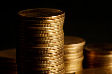Stack of Gold Coin on Black Background.